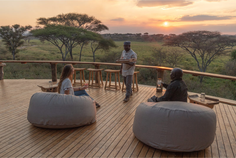 Tanzania - 17467 - Tarangire National Park - Olivers Camp - Sundowners - Guests enjoying cocktails on the deck